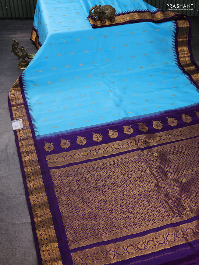 Pure gadwal silk saree light blue and deep violet with zari woven buttas and temple design zari woven border