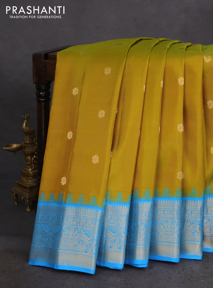Pure gadwal silk saree mustard green and cs blue with zari woven buttas and temple design zari woven border