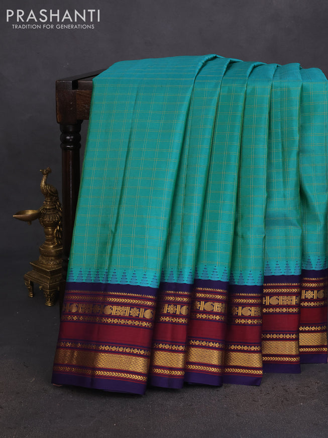 Pure gadwal silk saree green and navy blue with allover zari checked pattern and temple design zari woven border