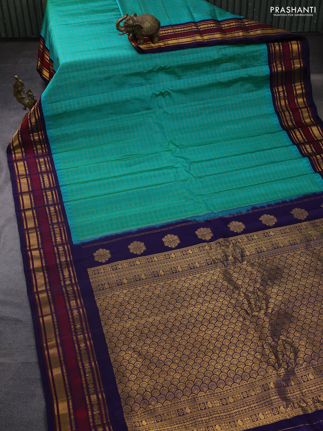 Pure gadwal silk saree green and navy blue with allover zari checked pattern and temple design zari woven border