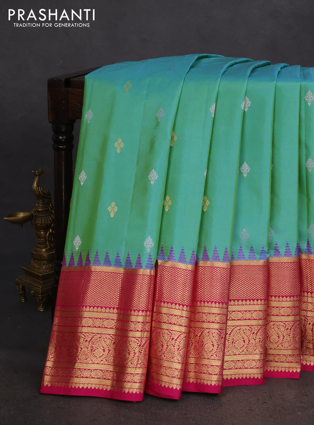 Pure gadwal silk saree dual shade of teal green and pink with zari woven buttas and temple design zari woven border