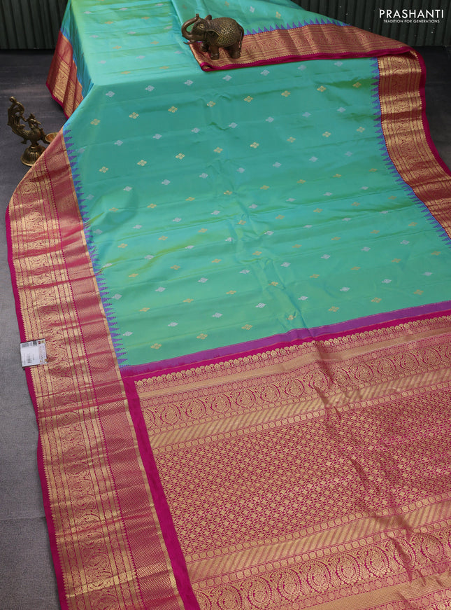 Pure gadwal silk saree dual shade of teal green and pink with zari woven buttas and temple design zari woven border