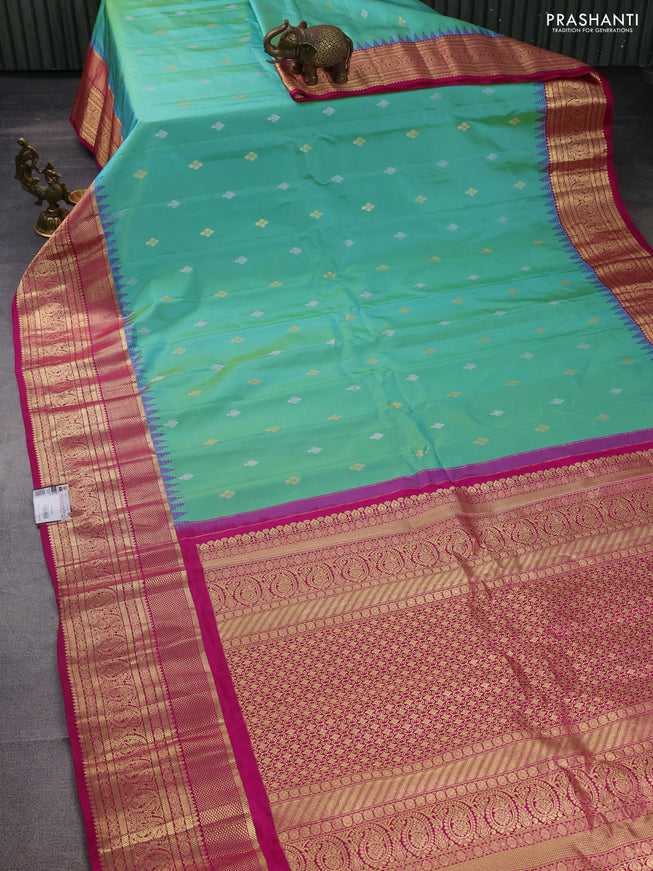 Pure gadwal silk saree dual shade of teal green and pink with zari woven buttas and temple design zari woven border