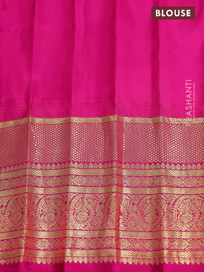 Pure gadwal silk saree dual shade of teal green and pink with zari woven buttas and temple design zari woven border
