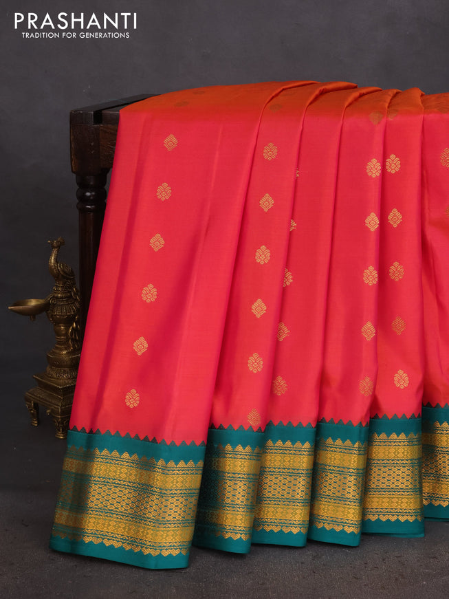 Pure gadwal silk saree dual shade of pinkish orange and teal green with zari woven buttas and temple design zari woven border