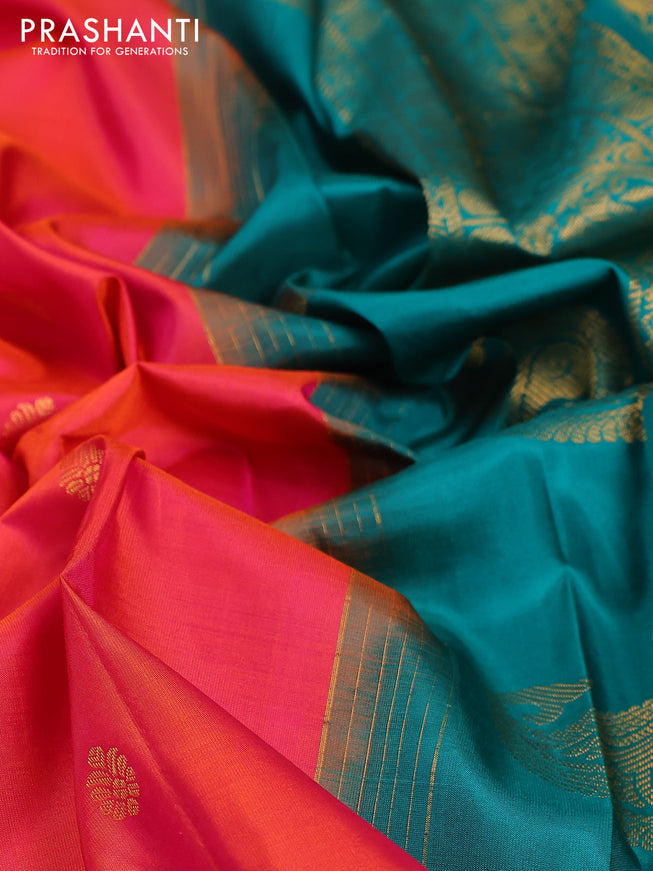 Pure gadwal silk saree dual shade of pinkish orange and teal green with zari woven buttas and temple design zari woven border