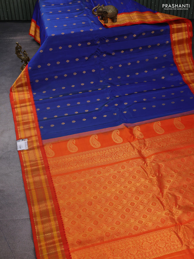 Pure gadwal silk saree dual shade of blue and orange with zari woven buttas and zari woven korvai border
