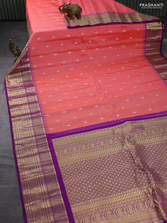Pure gadwal silk saree peach pink and deep purple with zari woven buttas and temple design zari woven border