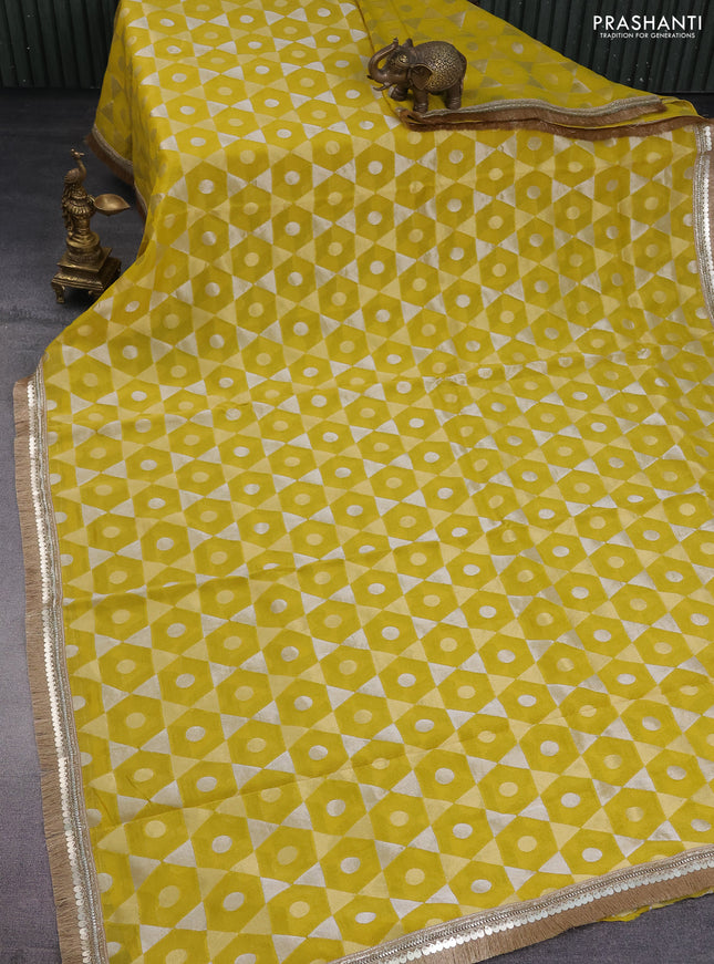 Banarasi tissue saree yellow and red with allover zari woven geometric wevaes and lace work border