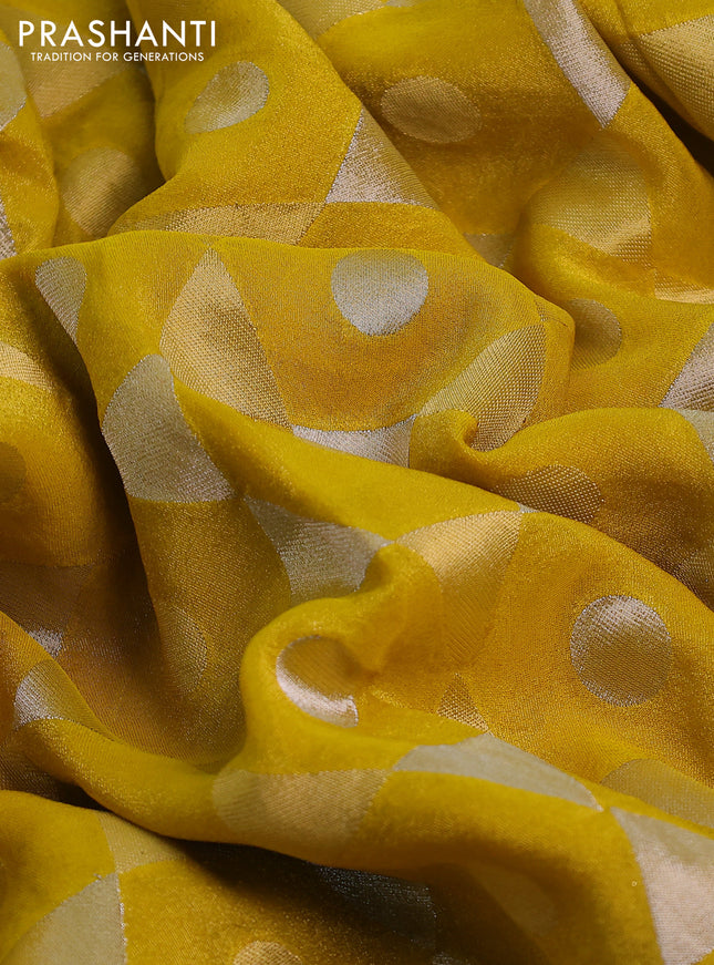 Banarasi tissue saree yellow and red with allover zari woven geometric wevaes and lace work border