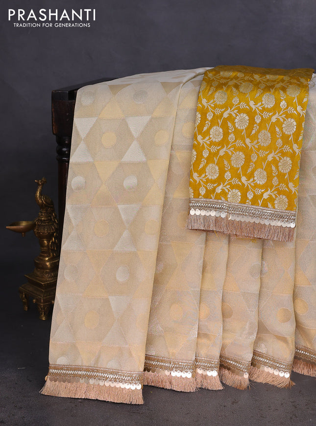 Banarasi tissue saree beige and mustard yellow with allover zari woven geometric wevaes and lace work border
