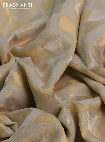Banarasi tissue saree beige and mustard yellow with allover zari woven geometric wevaes and lace work border