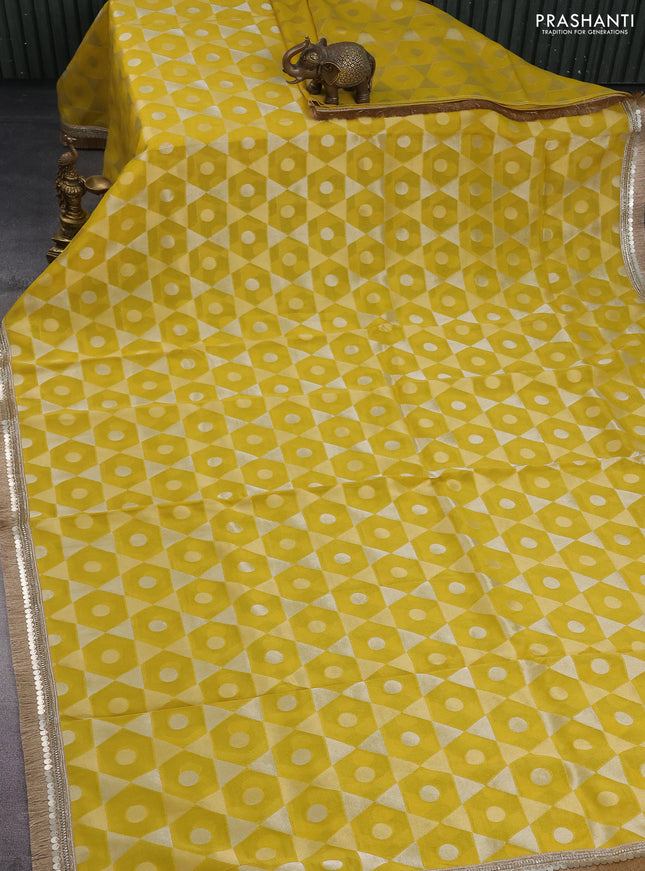 Banarasi tissue saree yellow and red with allover zari woven geometric wevaes and lace work border