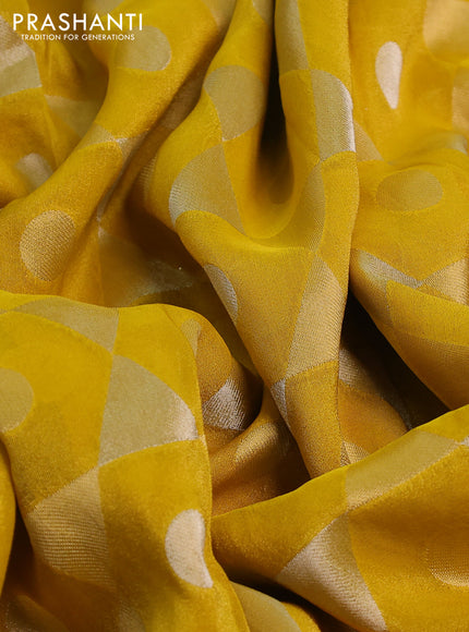 Banarasi tissue saree yellow and red with allover zari woven geometric wevaes and lace work border