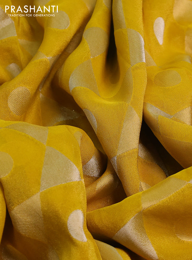 Banarasi tissue saree yellow and red with allover zari woven geometric wevaes and lace work border