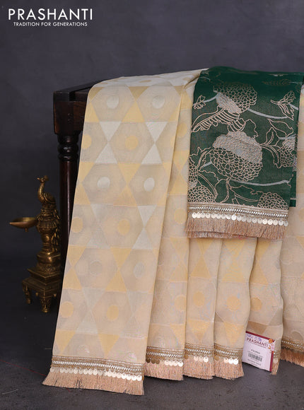 Banarasi tissue saree beige and dark green with allover zari woven geometric wevaes and lace work border