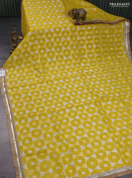 Banarasi tissue saree yellow and violet with allover zari woven geometric wevaes and lace work border