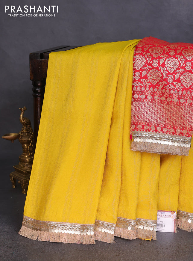 Banarasi tissue saree yellow and red with zari stripes pattern and lace work border
