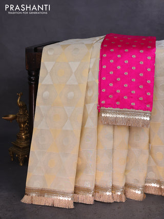 Banarasi tissue saree beige and pink with allover zari woven geometric wevaes and lace work border