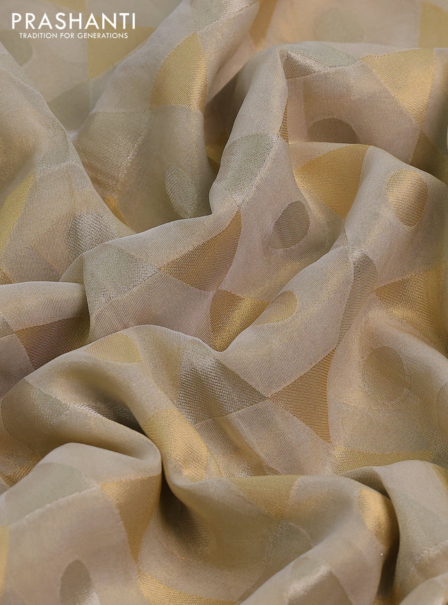 Banarasi tissue saree beige and pink with allover zari woven geometric wevaes and lace work border