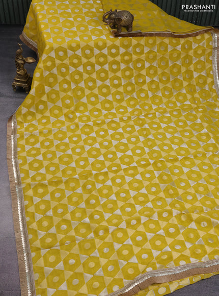 Banarasi tissue saree mustard yellow and red with allover zari woven geometric wevaes and lace work border