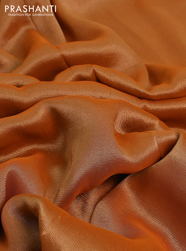 Banarasi tissue saree rust shade and red with plain body and lace work border