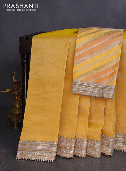 Banarasi tissue saree yellow with plain body and lace work border