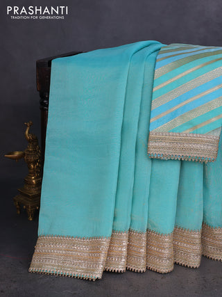 Banarasi tissue saree teal blue with plain body and lace work border