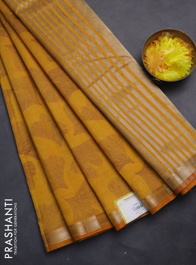 Semi raw silk saree mustard yellow with allover leaf butta prints and zari woven border