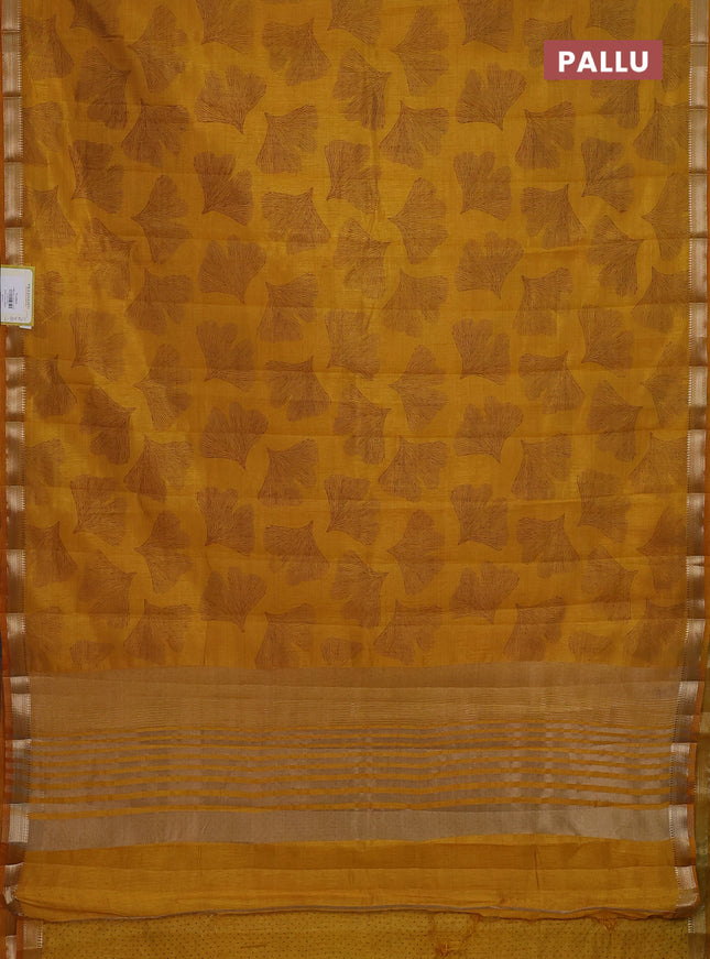 Semi raw silk saree mustard yellow with allover leaf butta prints and zari woven border