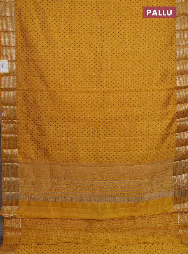 Semi raw silk saree mustard yellow with allover butta prints and zari woven border