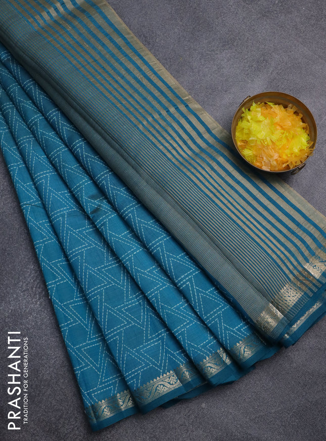 Semi raw silk saree peacock blue with allover geometric prints and zari woven border