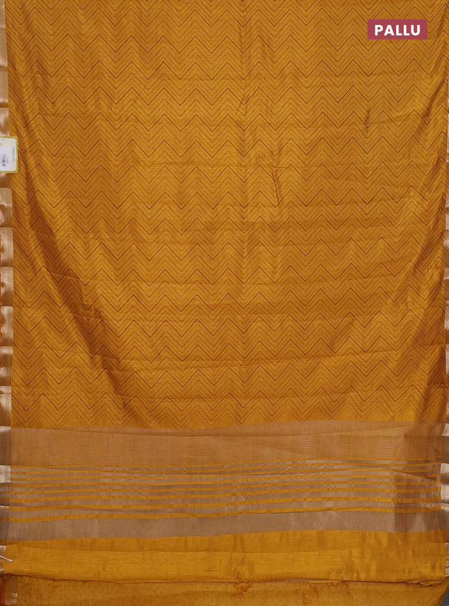 Semi raw silk saree mustard yellow with allover zig zag prints and zari woven border