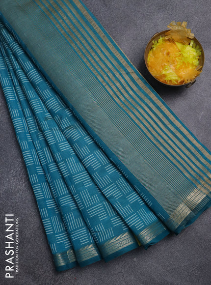 Semi raw silk saree teal blue with allover geometric prints and zari woven border