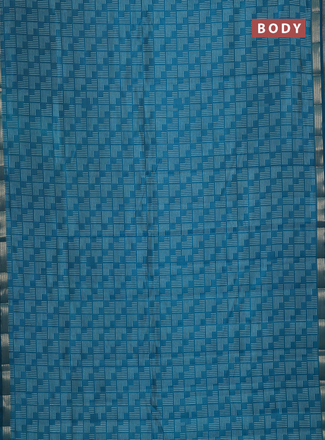 Semi raw silk saree teal blue with allover geometric prints and zari woven border