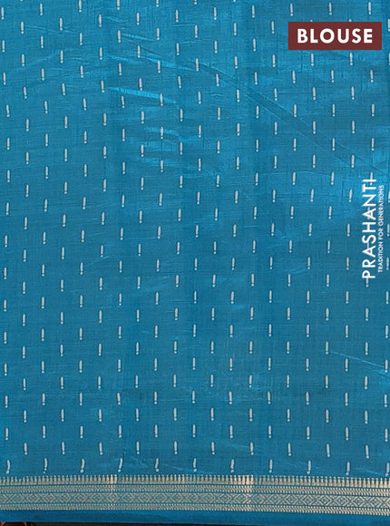 Semi raw silk saree teal blue with allover geometric prints and zari woven border