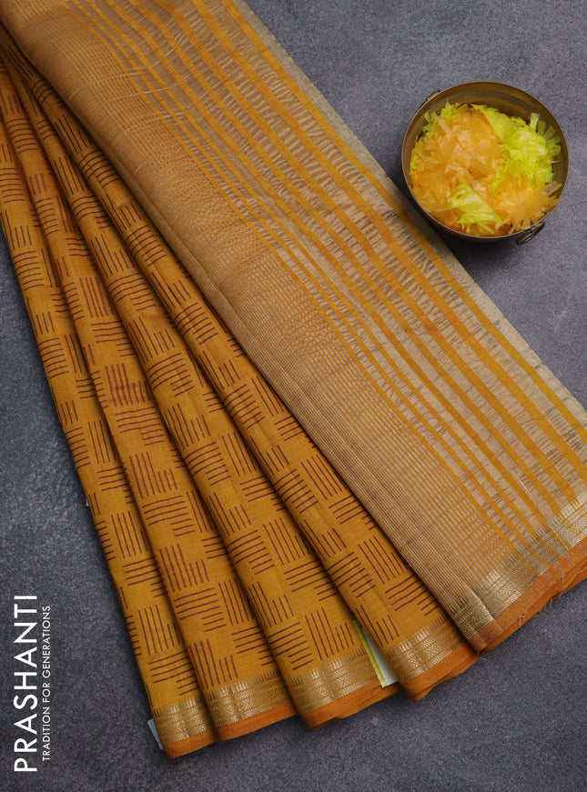 Semi raw silk saree dark mustard with allover geometric prints and zari woven border