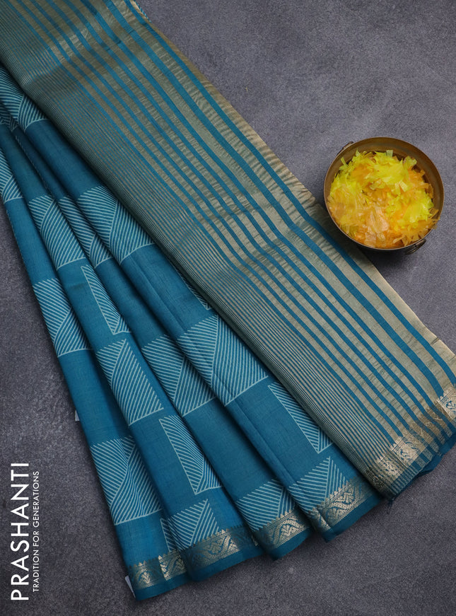 Semi raw silk saree teal blue with allover geometric butta prints and zari woven border