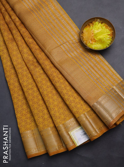 Semi raw silk saree dark mustard with allover geometric prints and zari woven border