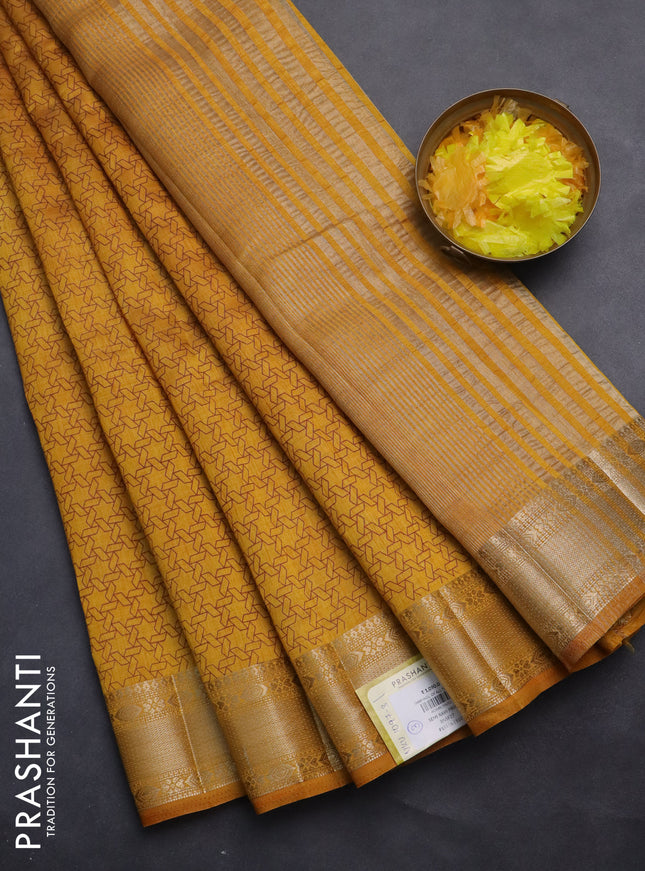 Semi raw silk saree dark mustard with allover geometric prints and zari woven border