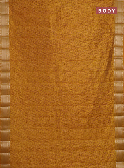 Semi raw silk saree dark mustard with allover geometric prints and zari woven border
