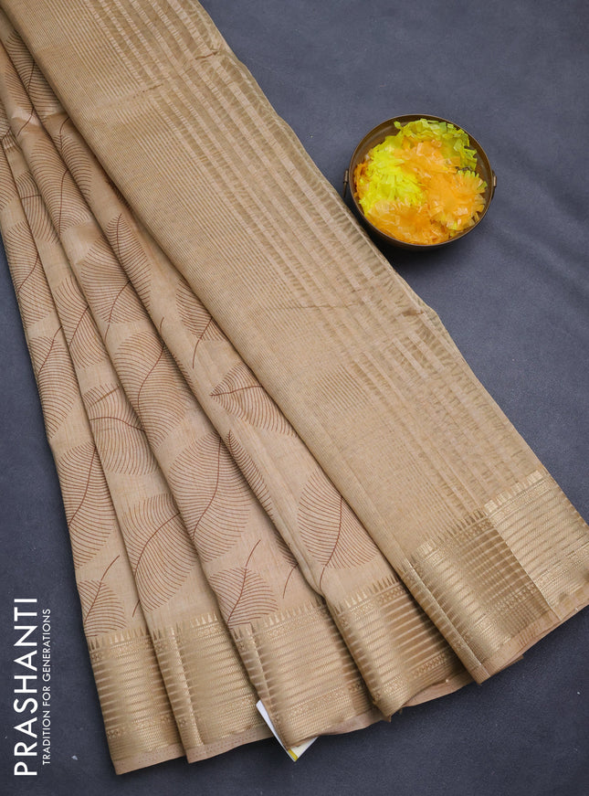 Semi raw silk saree sandal with allover leaf butta prints and zari woven border