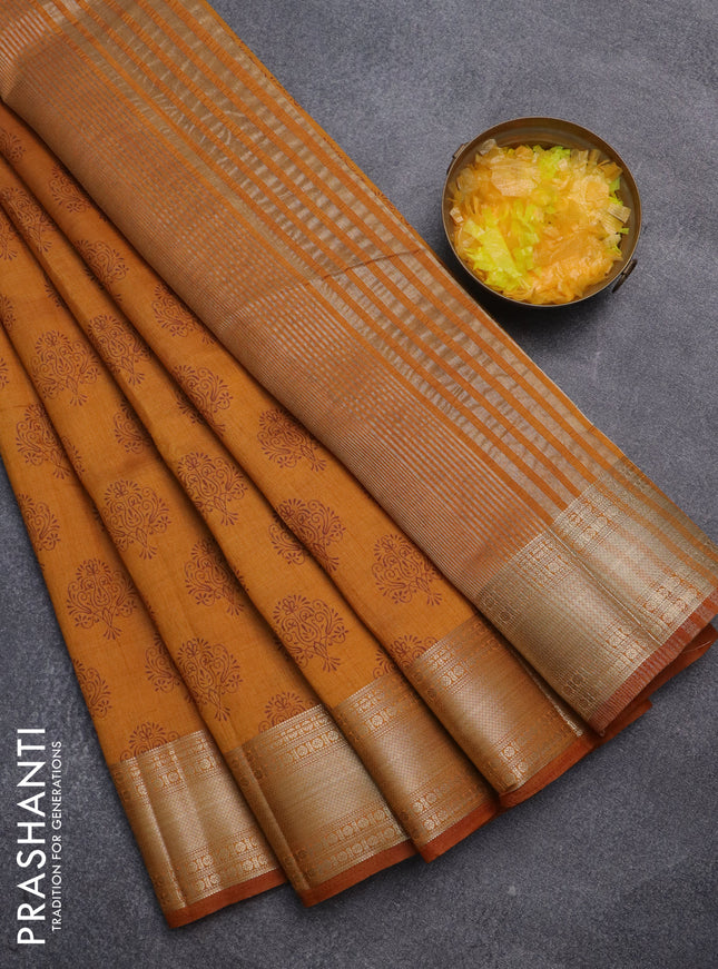 Semi raw silk saree dark mustard with allover butta prints and zari woven border