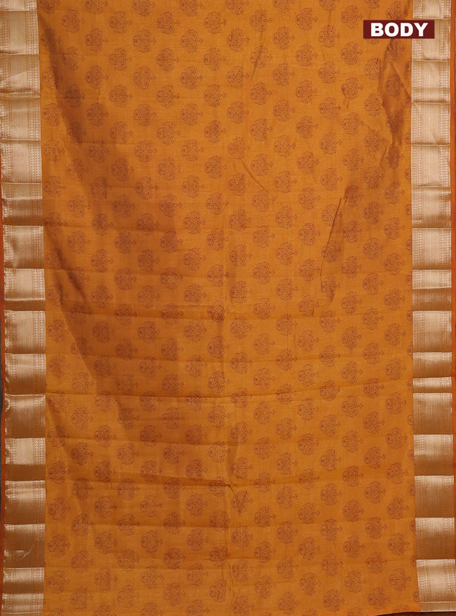 Semi raw silk saree dark mustard with allover butta prints and zari woven border