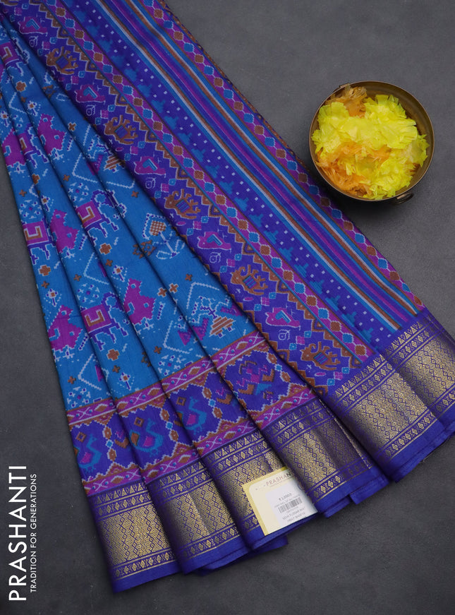 Semi tussar saree cs blue and blue with allover ikat prints and zari woven border