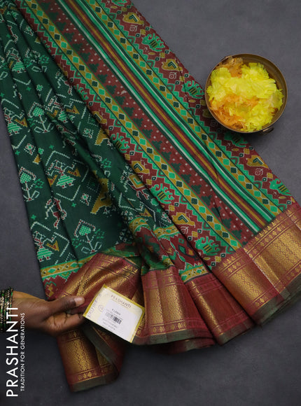 Semi tussar saree green and maroon with allover ikat prints and zari woven border