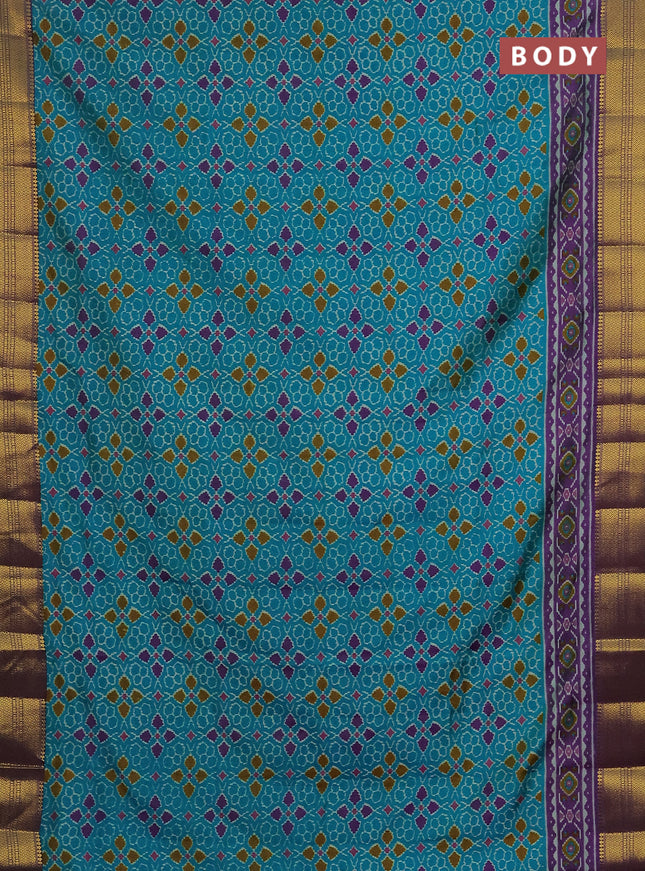Semi tussar saree teal blue and purple with allover ikat prints and zari woven border