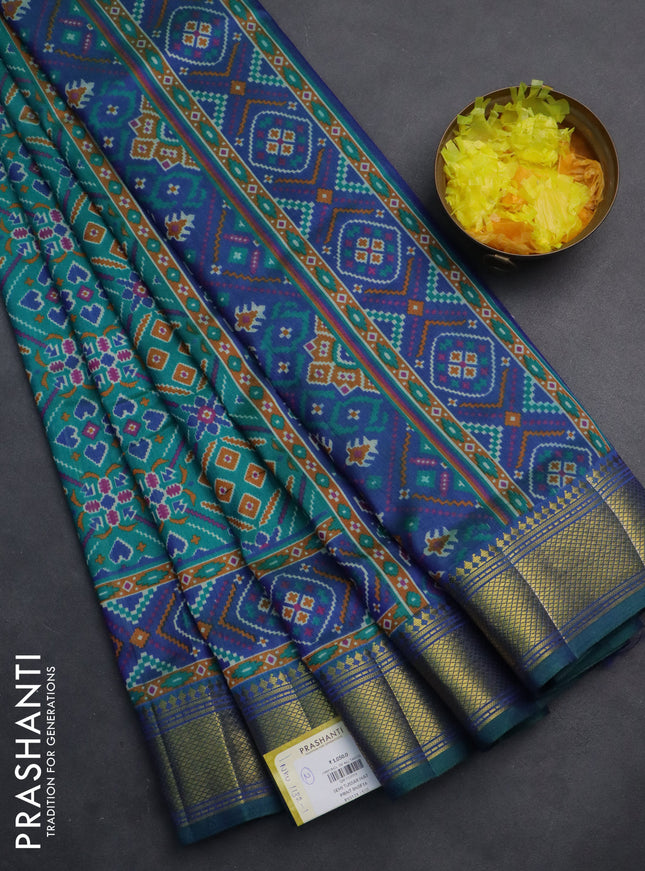 Semi tussar saree teal green and blue with allover ikat prints and zari woven border