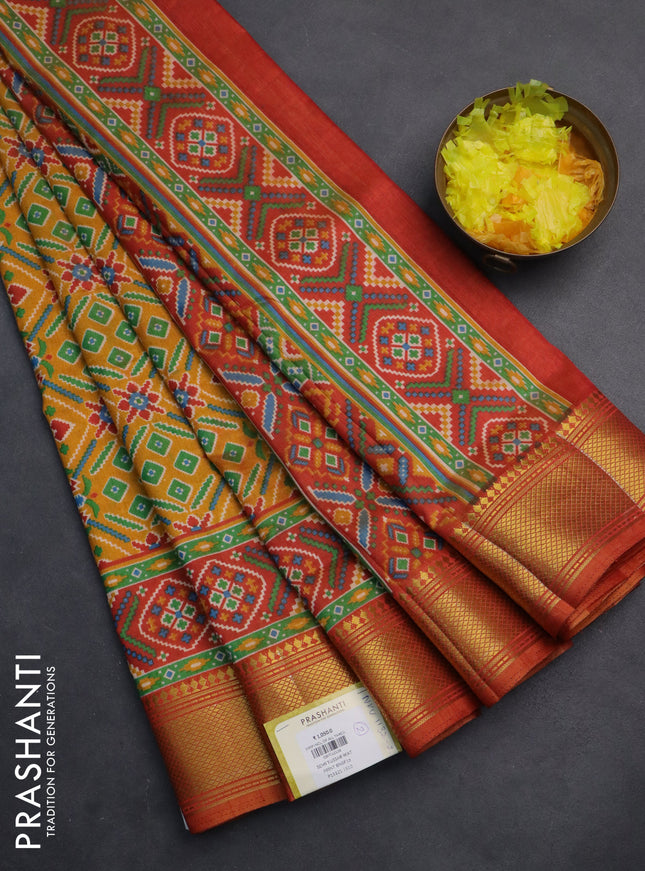 Semi tussar saree mustard yellow and red with allover ikat prints and zari woven border