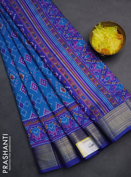 Semi tussar saree cs blue and blue with allover ikat prints and zari woven border